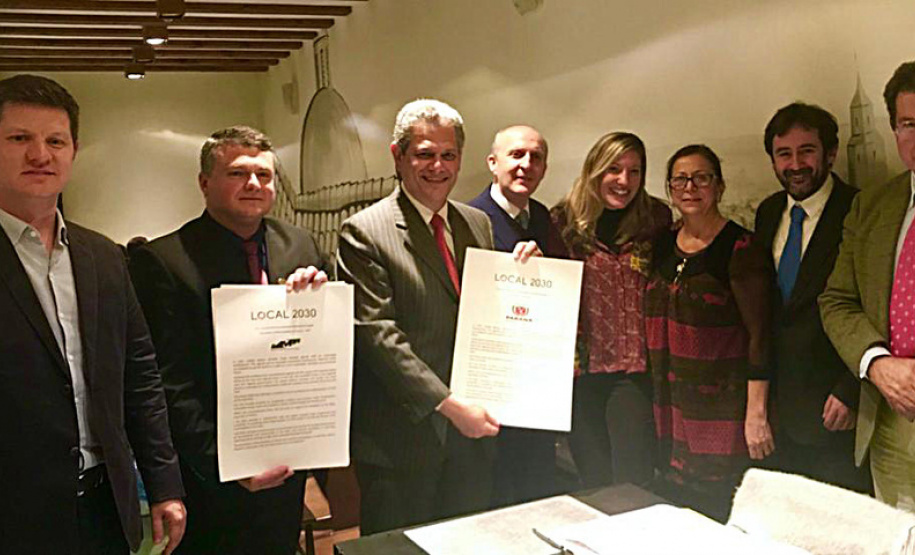 Paraná assina acordo com Programa Cidades do Pacto Global da ONU O Governo do Paraná, por meio do Paranacidade, firmou na quarta-feira (7), em Madri (Espanha), acordo com o Programa de Cidades do Pacto Global da Organização das Nações Unidas (UN Global Compact Cities Programme - Onu) para a implementação do projeto City Partnership Challenge no Estado (parceria de desafios entre cidades). - Foto: Divulgação SEDU